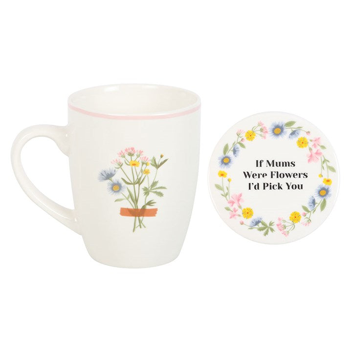 White mug with floral design and matching coaster on a white background