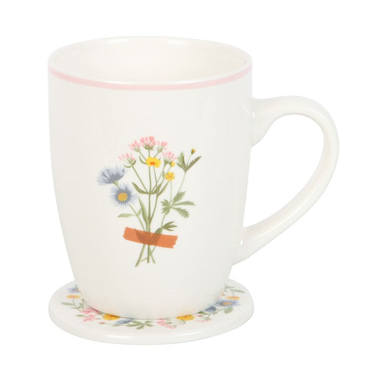 White mug with floral design on a white background