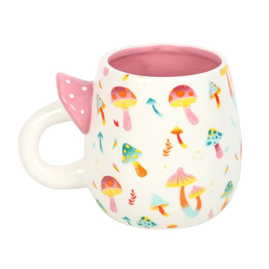 Mug with colorful mushroom pattern and pink interior on a white background
